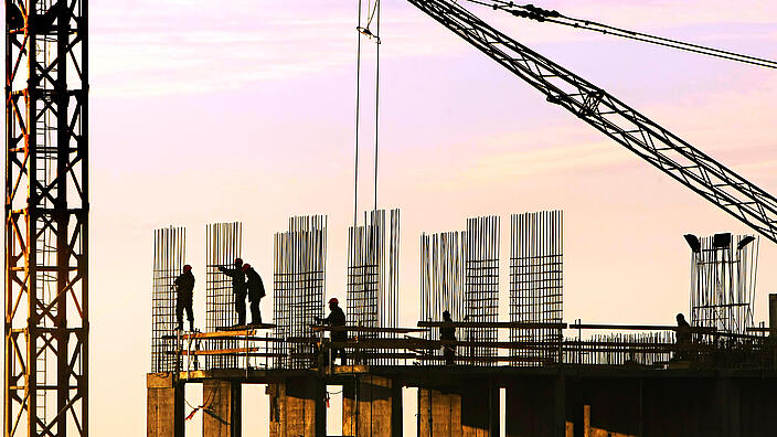 Silhouette of construction workers